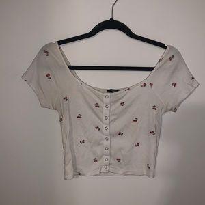 White cropped top with cherries on it